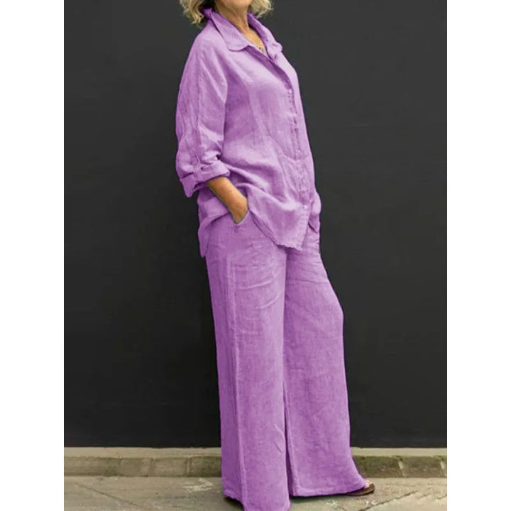 Woman wearing a stylish two-piece button-up shirt and wide-leg pants set, perfect for spring or summer.