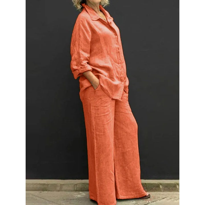 Detailed view of a button-up shirt & flowy wide-leg pants, a relaxed two-piece women's matching set.