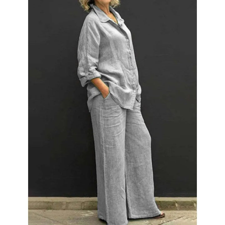 Elegant women's coordinated two-piece set featuring a button-up shirt and comfortable wide-leg pants.