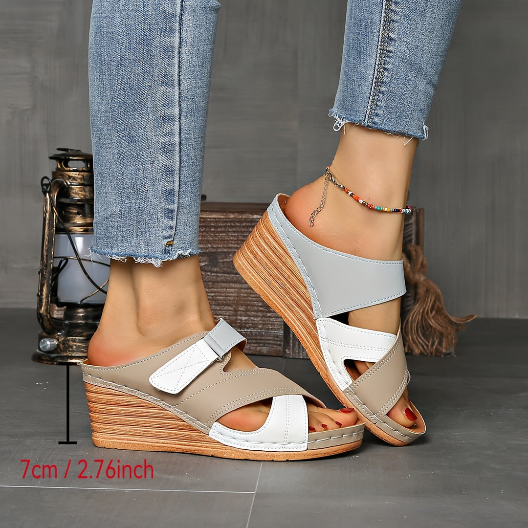 Elevate your summer look with these two-tone wedge slides for women. Open-toe, comfortable, slip-on.