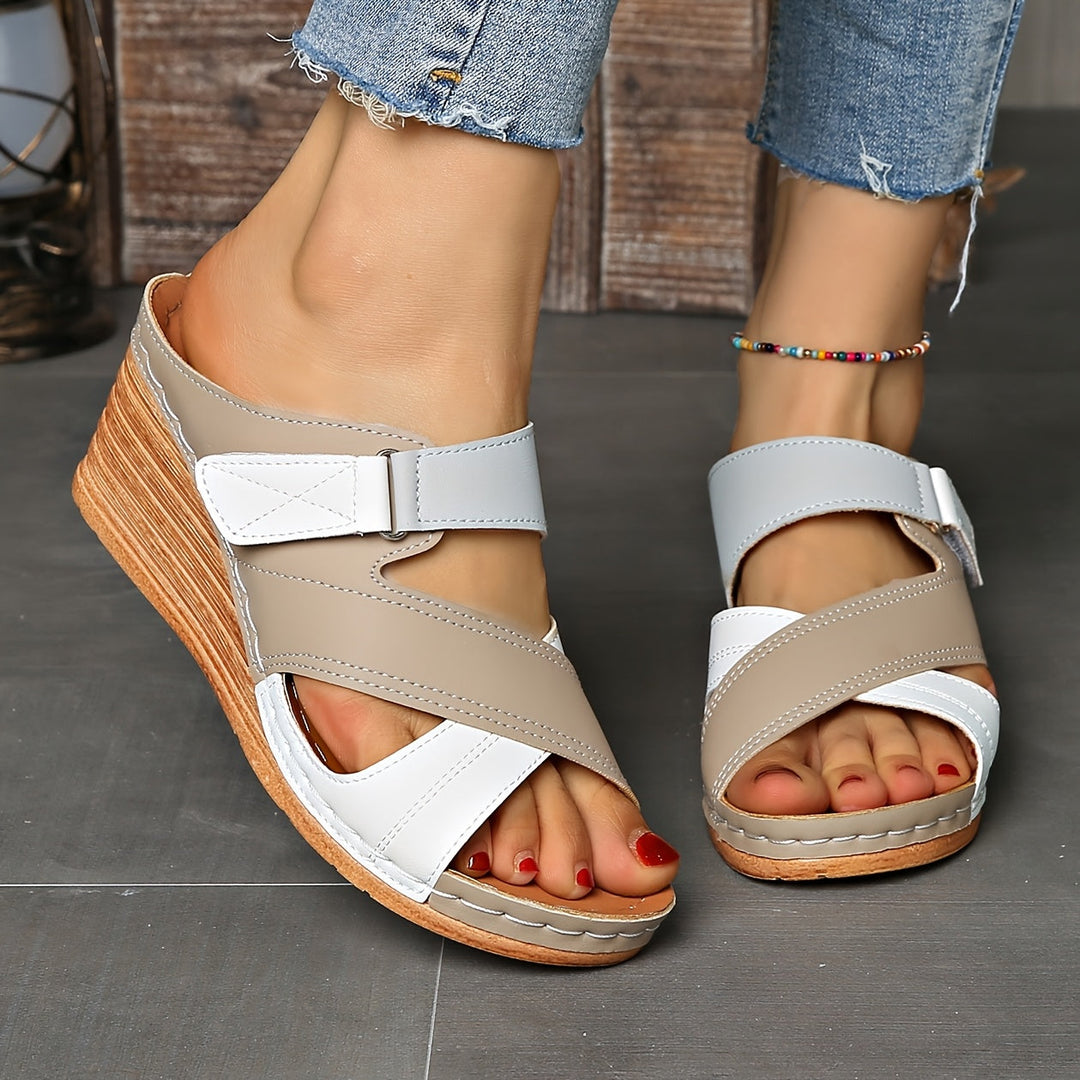 Stylish two-tone wedge slides for women. Chic open-toe summer footwear, easy to slip on.