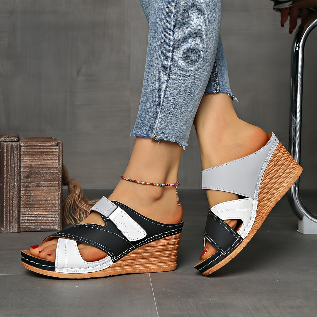 Women's two-tone wedge slides, comfortable slip-on summer sandals with a chic open-toe design.