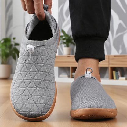Woman wearing cozy mesh slip-on sneakers, demonstrating lightweight comfort, breathability & casual style.
