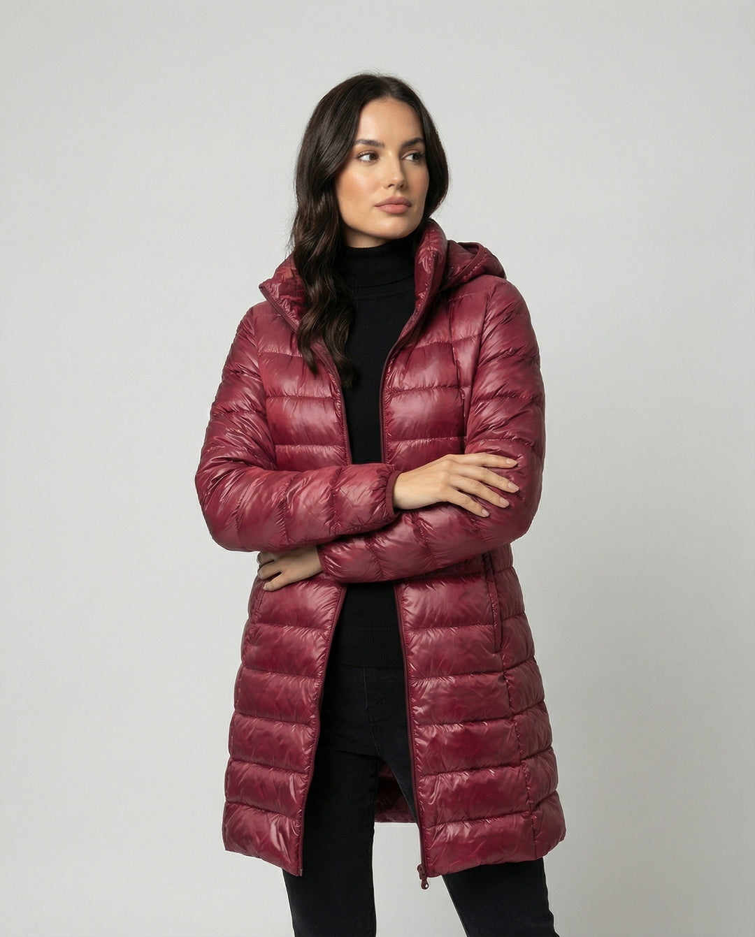 Stylish women's hooded winter coat, ultralight and insulated for warmth in cold weather.