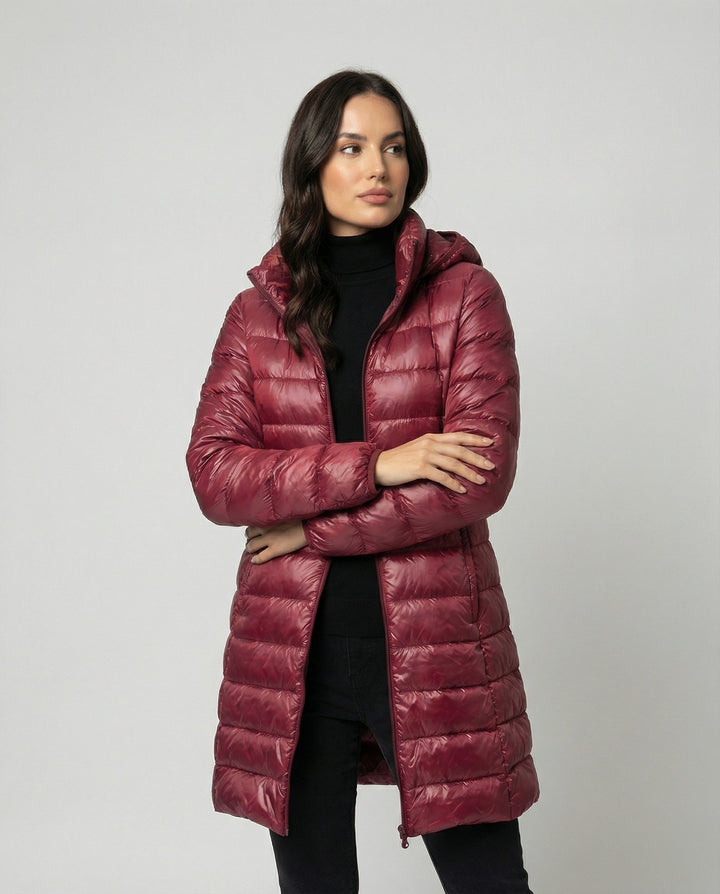 Stylish women's hooded winter coat, ultralight and insulated for warmth in cold weather.