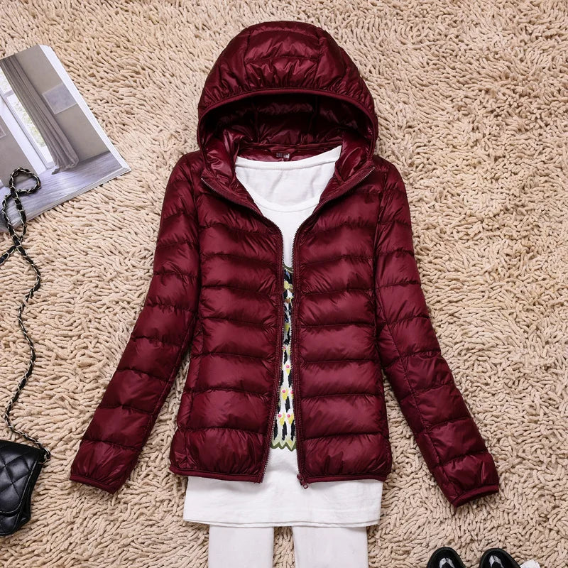 Ultralight women's hooded jacket, offering insulated warmth for versatile use.
