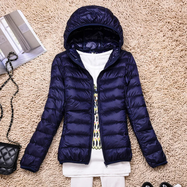 Warm & stylish women's insulated coat, featherlight and hooded for winter fashion.