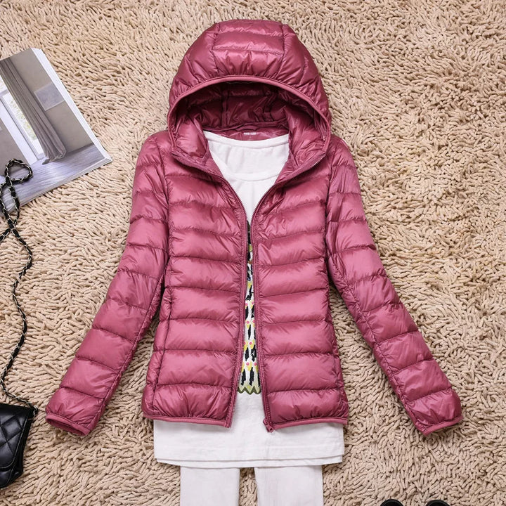 Lightweight women's winter jacket, insulated & hooded for superior warmth & style.