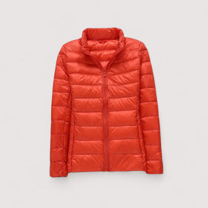 Women's ultralight cold weather jacket, stylish and warm, ideal for winter travel.