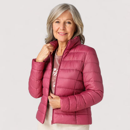Women's insulated ultralight jacket, a warm & chic travel essential for winter.
