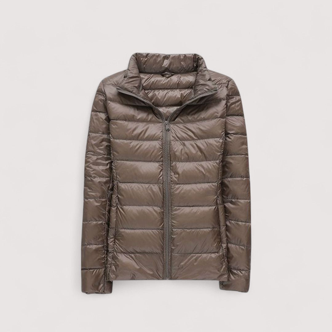 Warm women's ultralight winter coat, a travel essential for cold weather comfort.