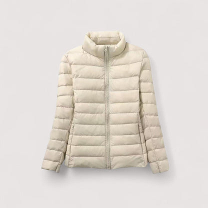 Women's ultralight jacket, a warm travel essential, ideal for cold weather adventures.