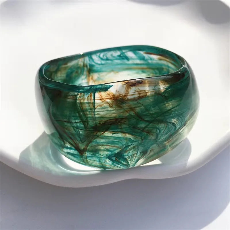 Elegant women's acrylic marble bangle with unique irregular shape. Modern fashion jewelry bracelet for her.