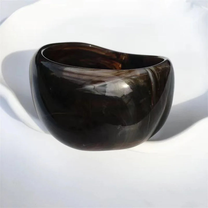 Stylish women's irregular marble acrylic bangle bracelet. A unique fashion accessory for everyday or events.