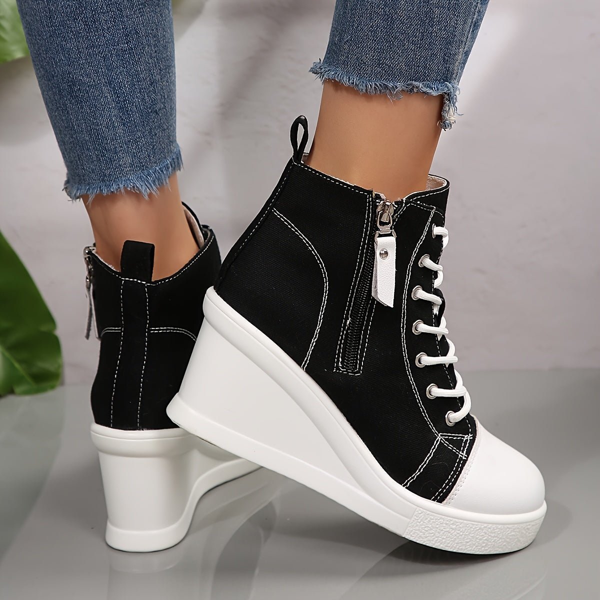 Stylish women's platform wedge sneakers with a hidden heel, great for modern streetwear fashion.