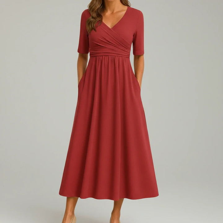 Chic women's V-neck midi dress in an A-line silhouette with practical side pockets for effortless style.