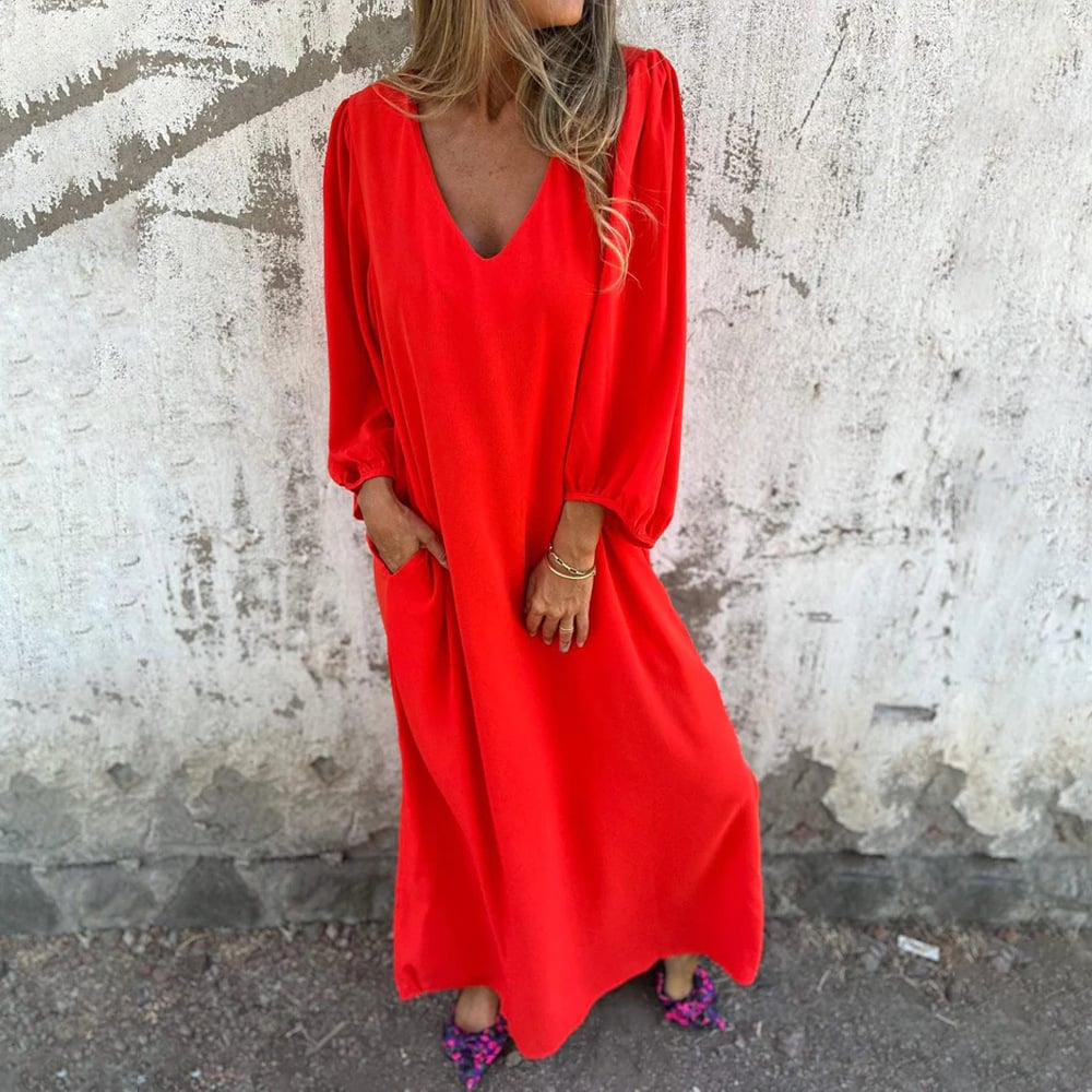 Elegant women's flowy maxi dress with V-neck and balloon sleeves, ideal for casual outings or a summer party.
