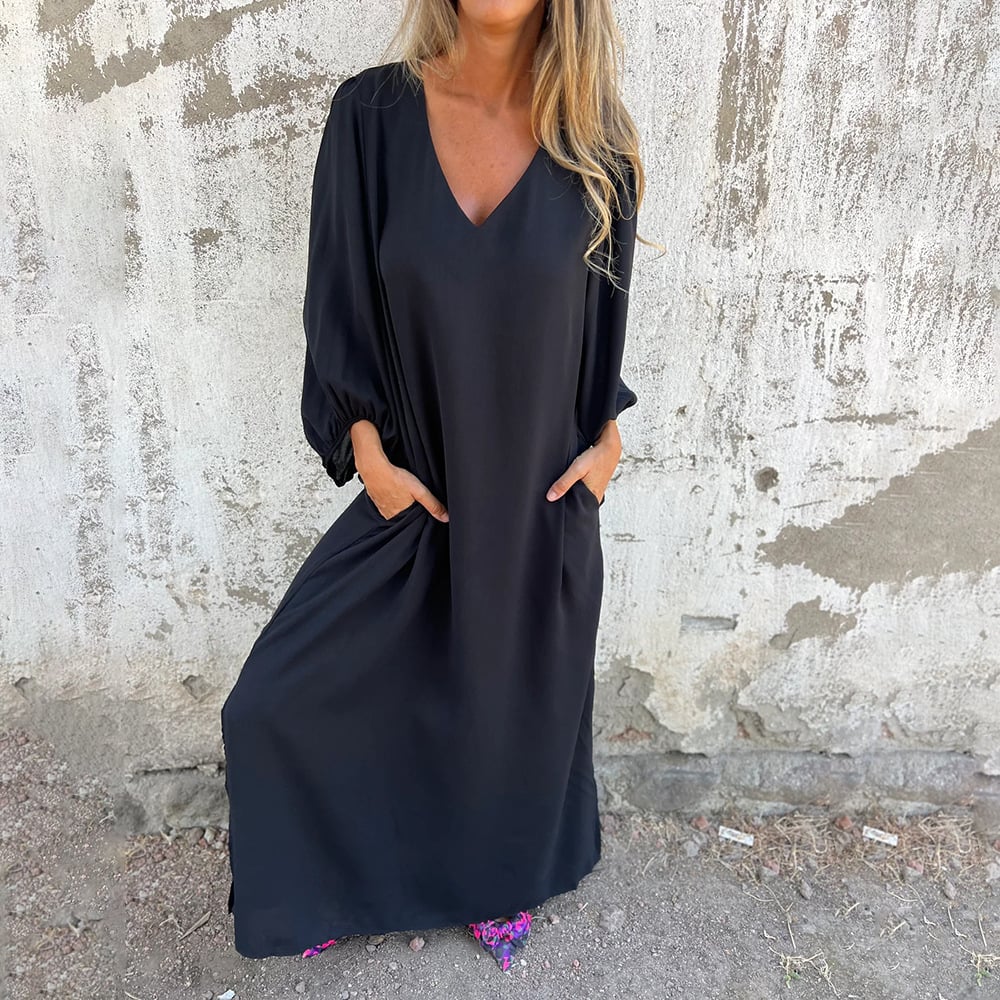 Comfortable women's casual maxi dress, featuring a flattering V-neck, flowy skirt, and stylish balloon sleeves.