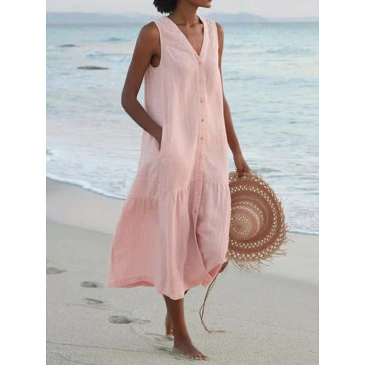 Elegant women's V-neck button front tiered midi dress. Sleeveless, perfect for summer day wear with pockets.