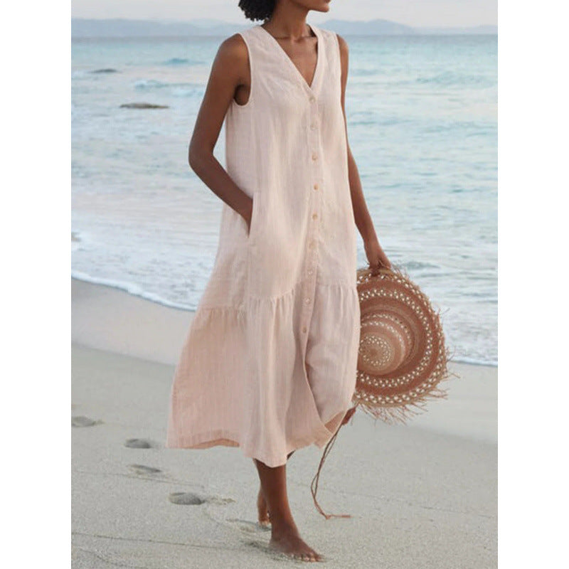 Lightweight women's tiered midi dress with V-neck, button front. Sleeveless, perfect for warm day wear.