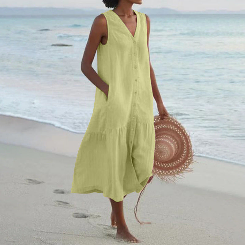 Casual women's tiered midi dress with V-neck & button front. Sleeveless for a cool summer look.