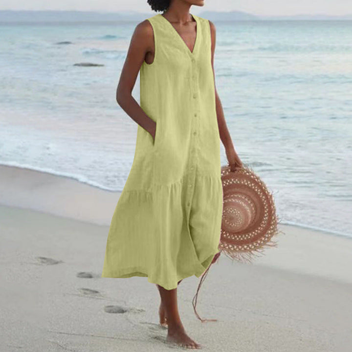 Casual women's tiered midi dress with V-neck & button front. Sleeveless for a cool summer look.