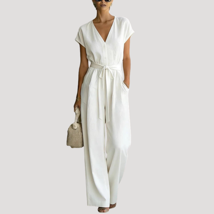 Women's V-neck cap sleeve wide leg jumpsuit with tie waist. Elegant and comfortable one-piece summer fashion.