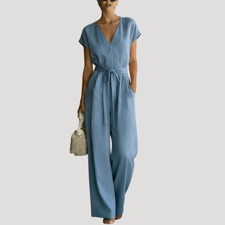 Elegant women's wide-leg jumpsuit. Features V-neck, cap sleeves, and tie waist. Perfect versatile summer style.
