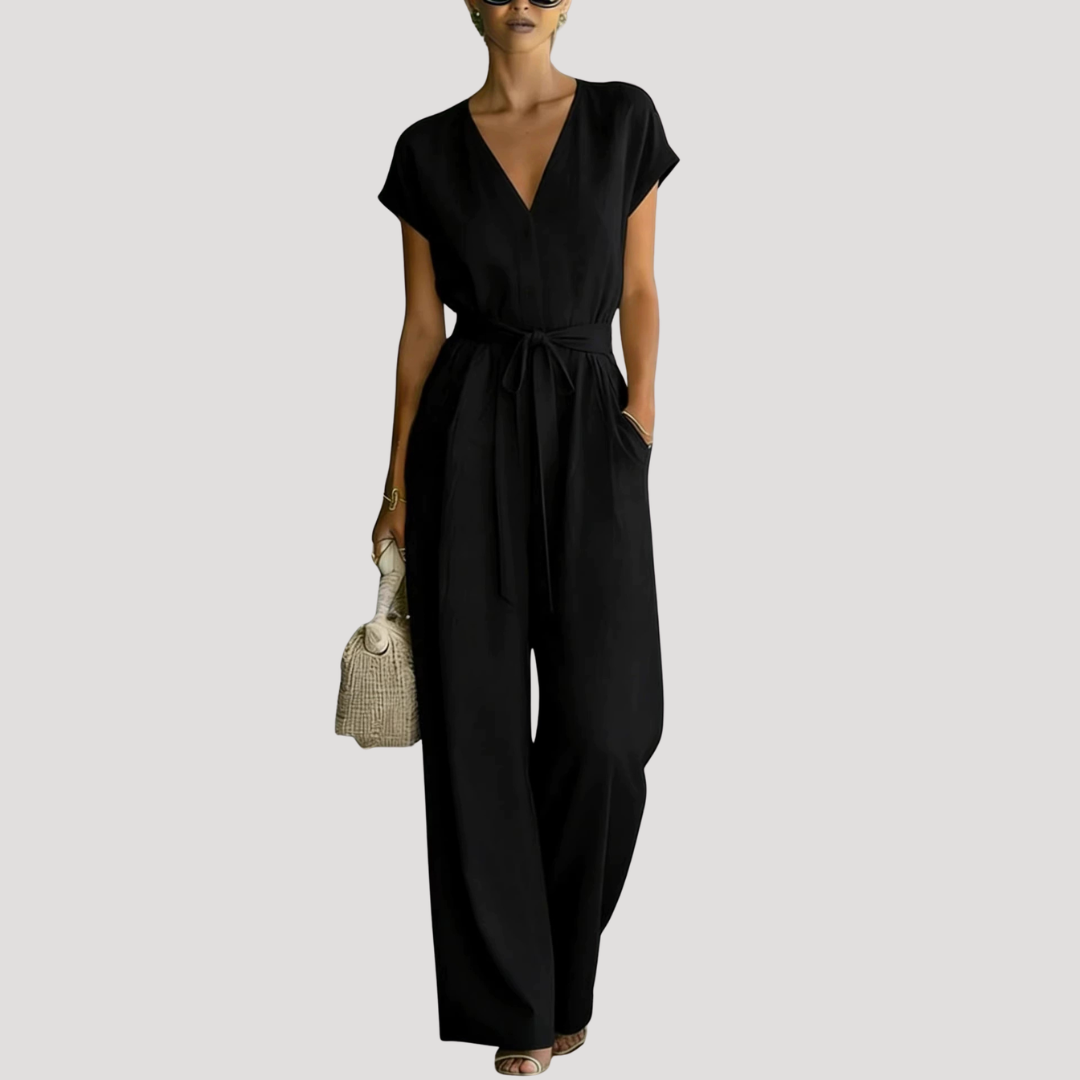 Comfortable women's cap sleeve V-neck jumpsuit. Stylish wide-leg design with an adjustable tie waist for a flattering fit.