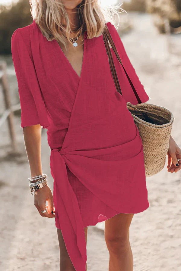 Stylish V neck mini dress for women, featuring elegant draping, ideal for parties or casual chic looks.