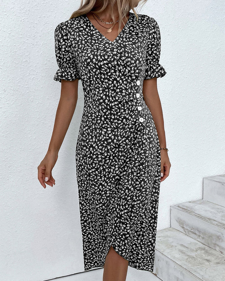 Women's floral print V-neck flowy summer midi dress. A versatile, casual elegant piece for spring wardrobes.