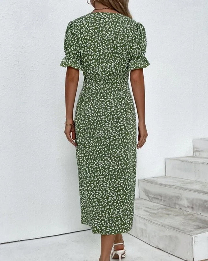 Detailed V-neckline of a women's floral print flowy summer midi dress. Elegant and comfortable.