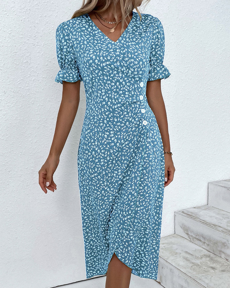 Women's floral V-neck flowy summer midi dress worn outdoors in a garden setting. Casual elegant spring outfit.