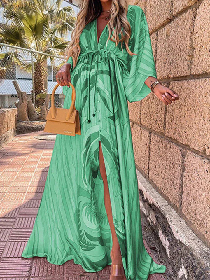 Stylish women's long dress: V-neck, kimono sleeves, and high slit for a flattering, elegant look.