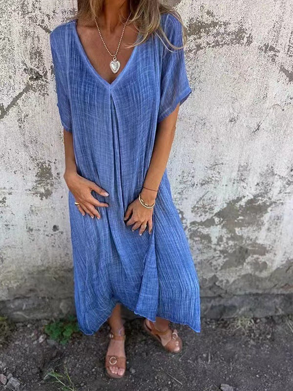 Relaxed women's V-neck kimono midi dress, tiered for beach or vacation, effortless casual summer fashion.
