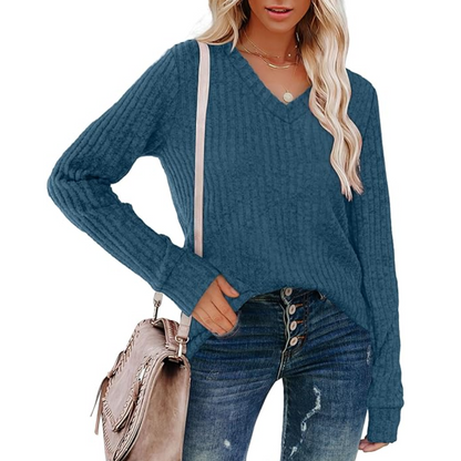 Model wearing women's V-neck lightweight tunic sweater, styled for comfortable everyday fashion.