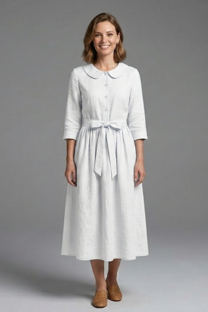 Blue women's V-neck midi dress with waist tie, a versatile choice for day or evening wear.