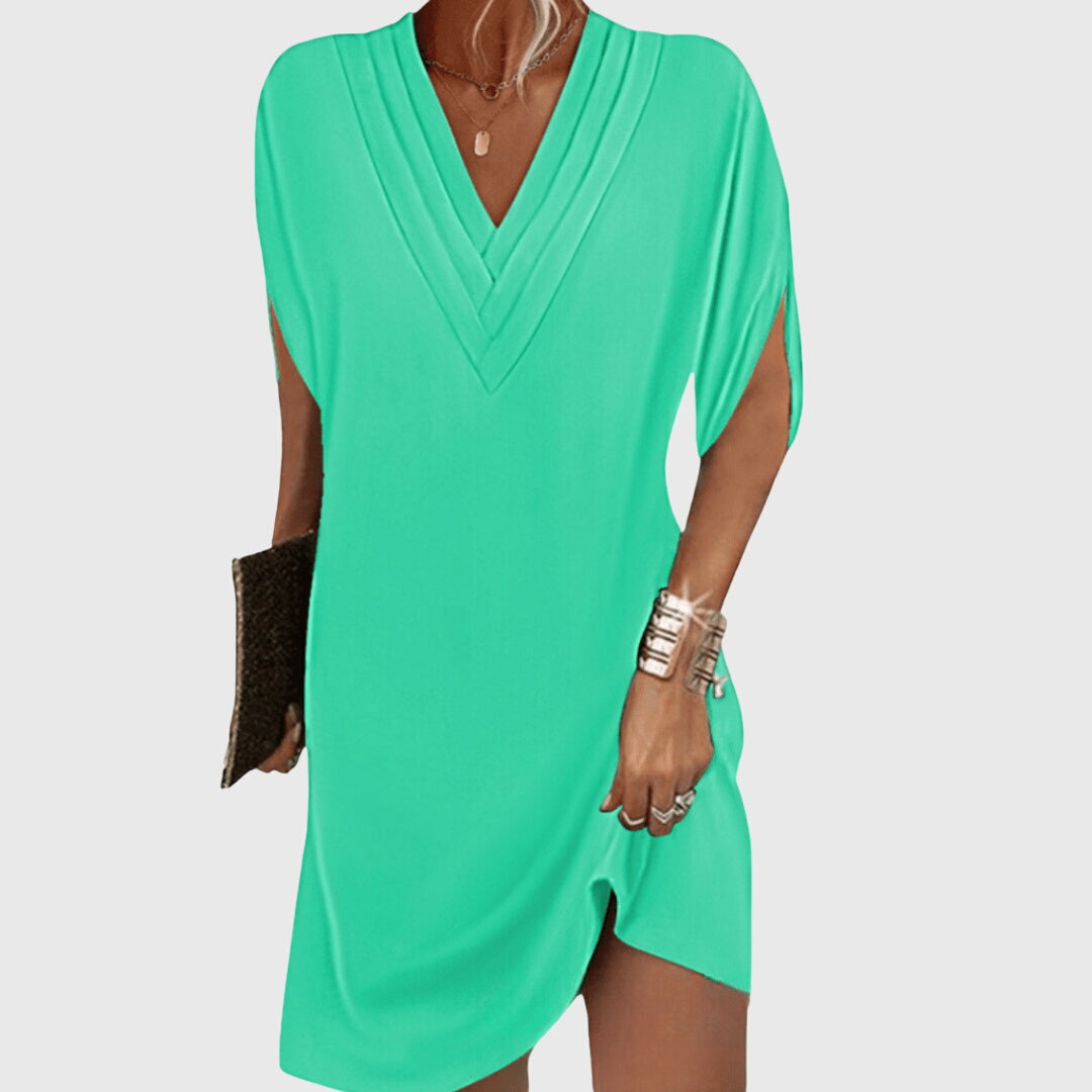 Short sleeve V-neck mini dress, women's relaxed cocoon style, versatile for casual wear & vacations.