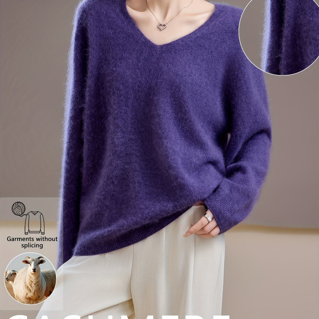 Woman wearing an elegant V-neck oversized sweater, styled for chic autumn layering & versatile winter fashion.