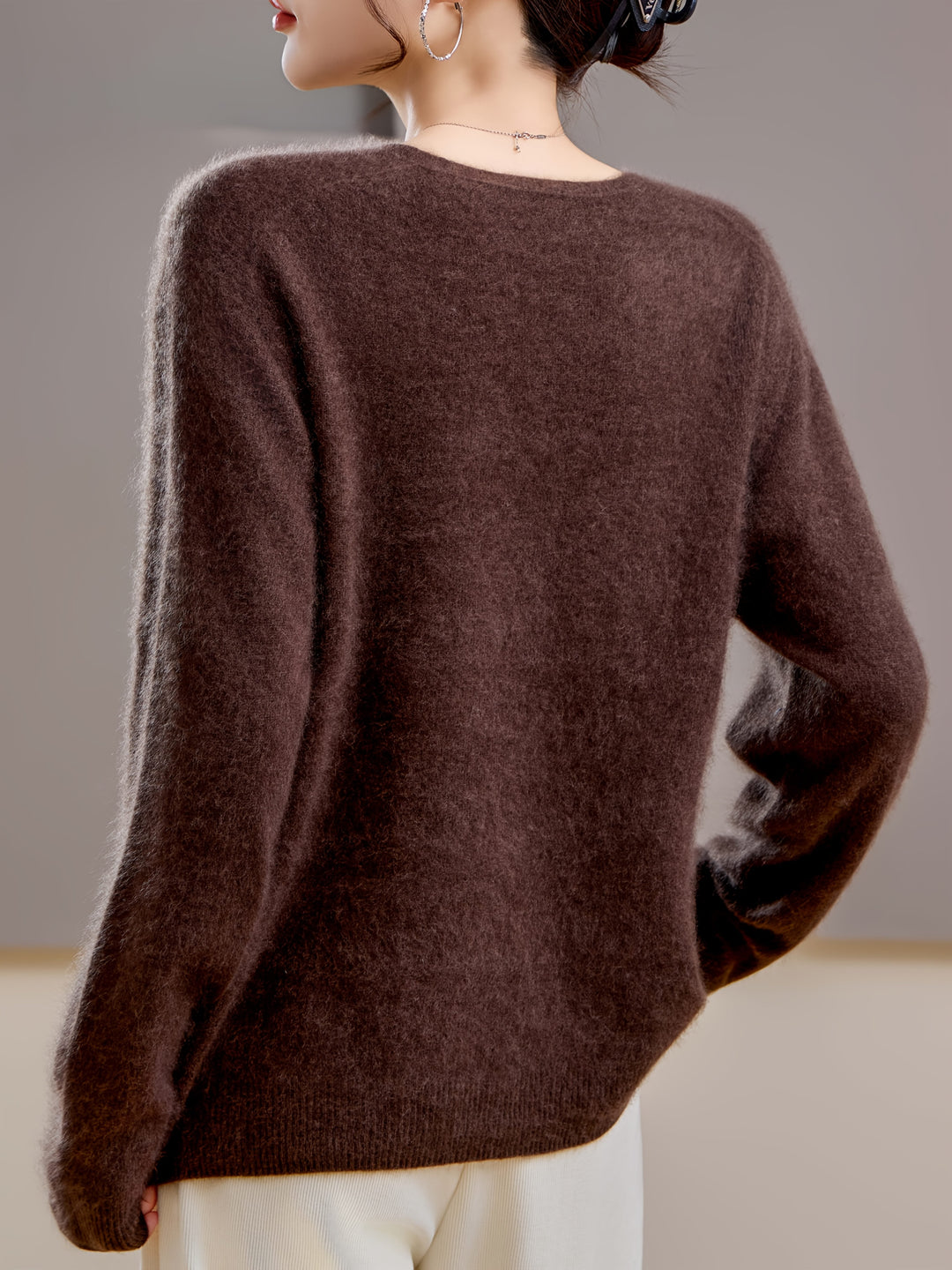 Elegant V-neck women's sweater, versatile for autumn layering, oversized fit, chic winter fashion.