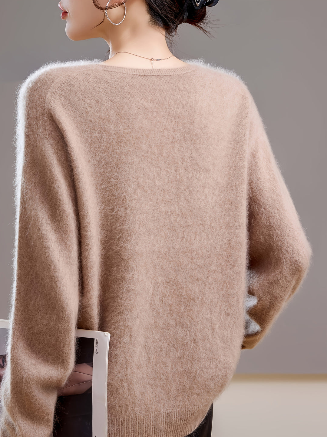 Stylish V-neck women's sweater, designed for elegant autumn layering. Comfortable oversized fit & warm knit.