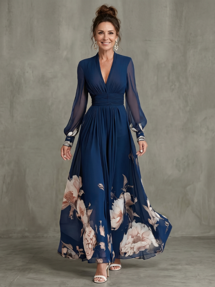 Women's V-neck pleated maxi dress with elegant sheer long sleeves, ideal for evening or party wear.