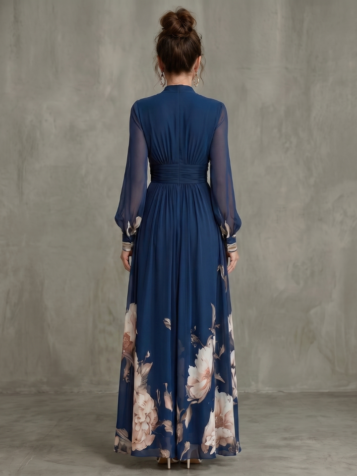 Flowy women's V-neck maxi dress with elegant sheer long sleeves & pleated detail. Ideal for formal or casual.