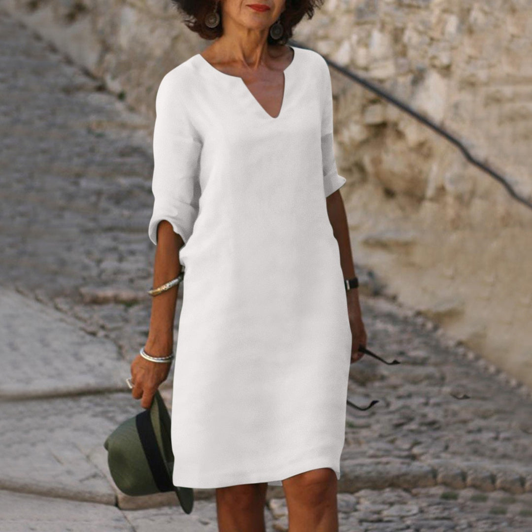 Stylish women's V-neck relaxed fit midi dress, suitable for various summer & spring occasions.