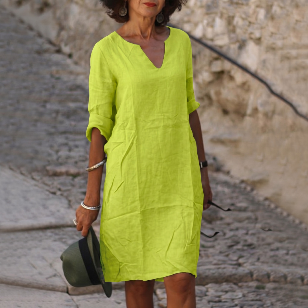 Casual women's V-neck summer midi dress with a relaxed fit, perfect for warm weather comfort.