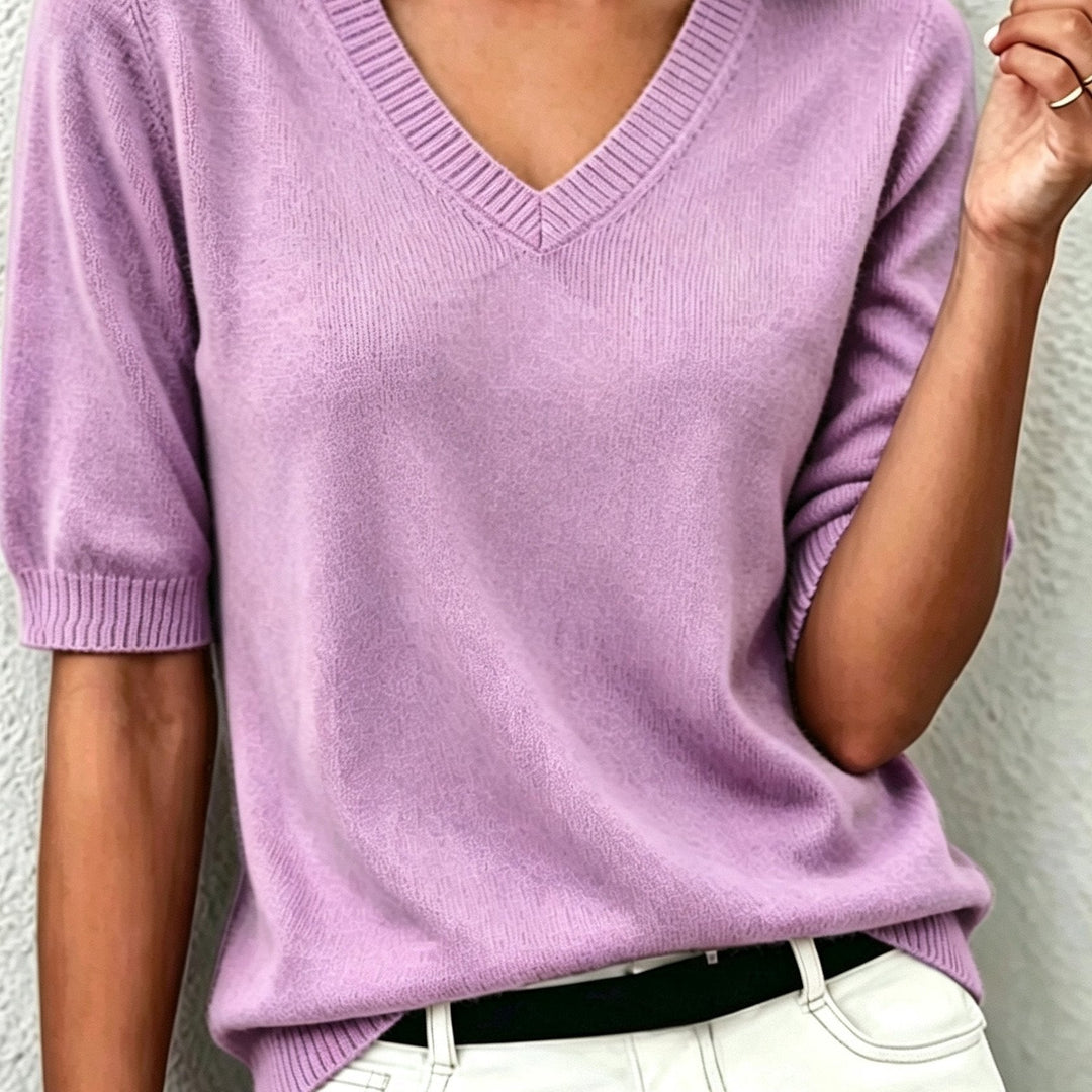 Grey V-neck short-sleeve sweater for women. Smart casual knit top, ideal for office style.