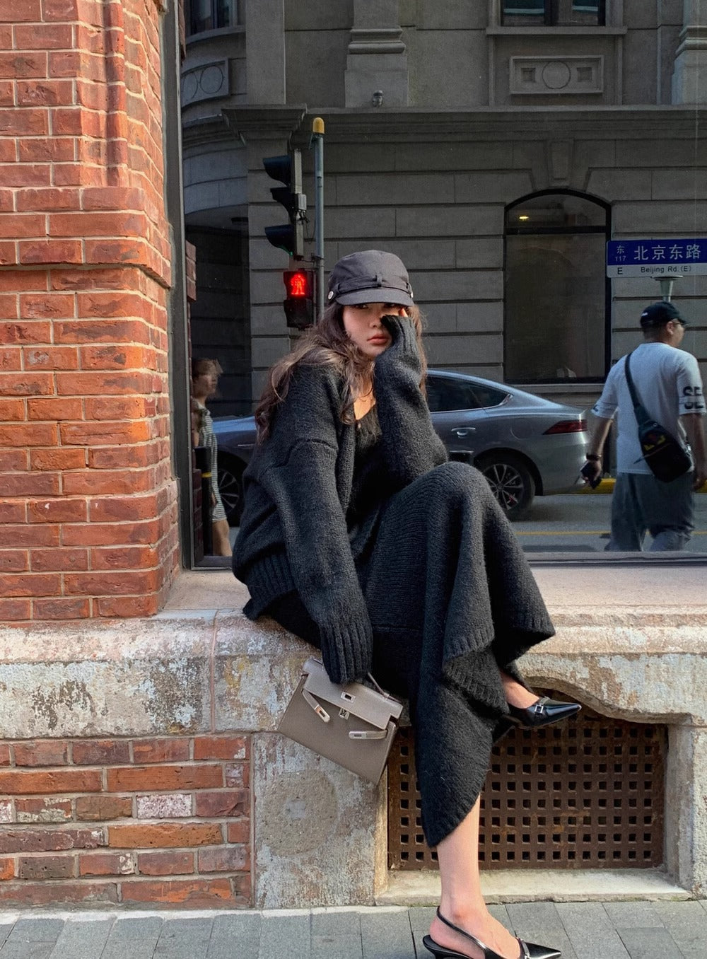 Versatile women's V-neck long sleeve sweater and midi skirt matching set for casual or elegant looks.