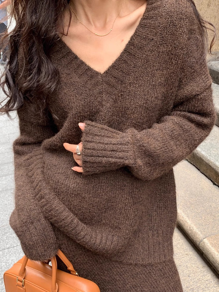 Comfortable & elegant women's V-neck long sleeve sweater and midi skirt matching set for versatile fashion.