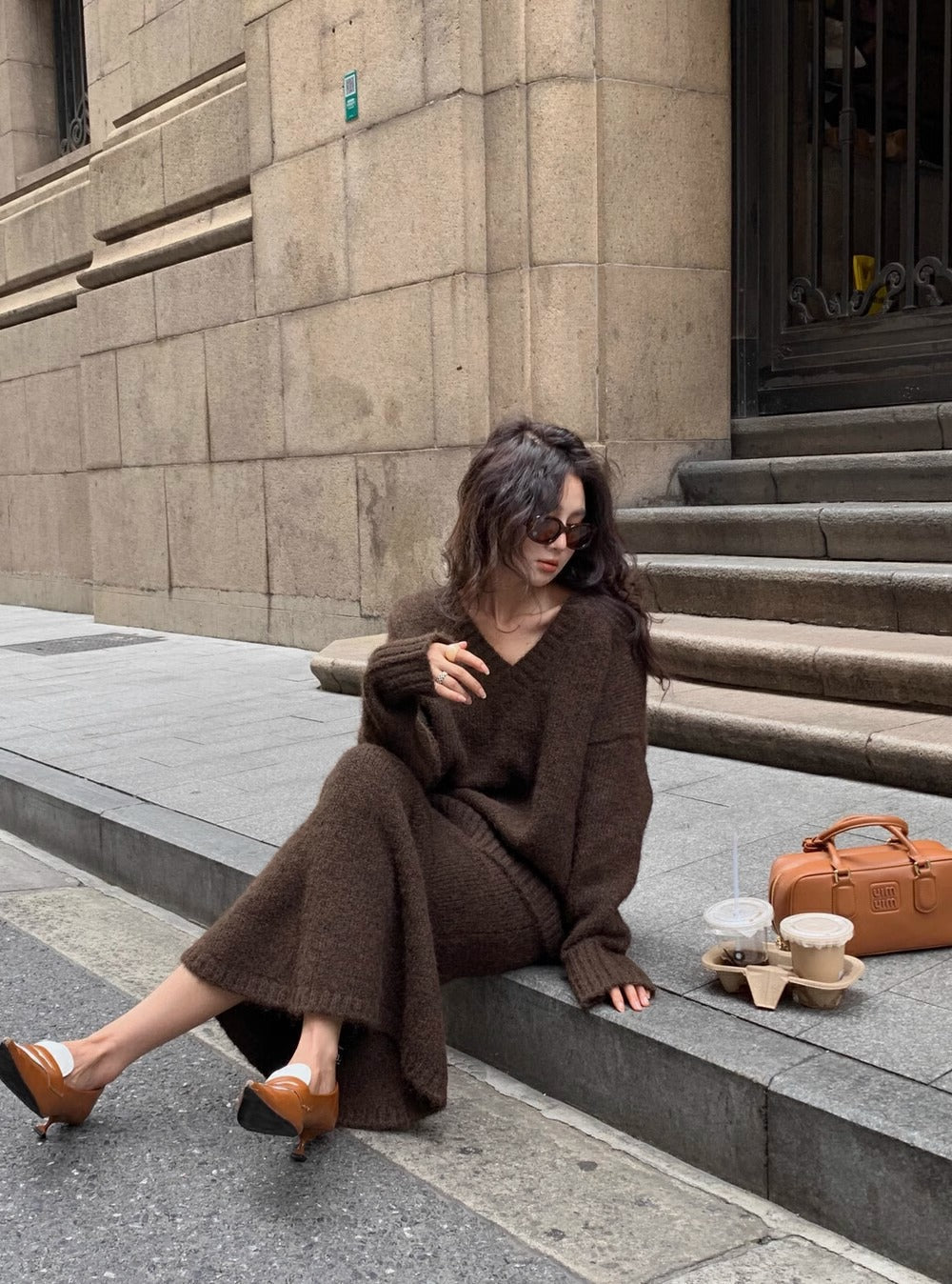 V-neck long sleeve sweater and midi skirt matching set. Comfortable two-piece women's outfit for all seasons.
