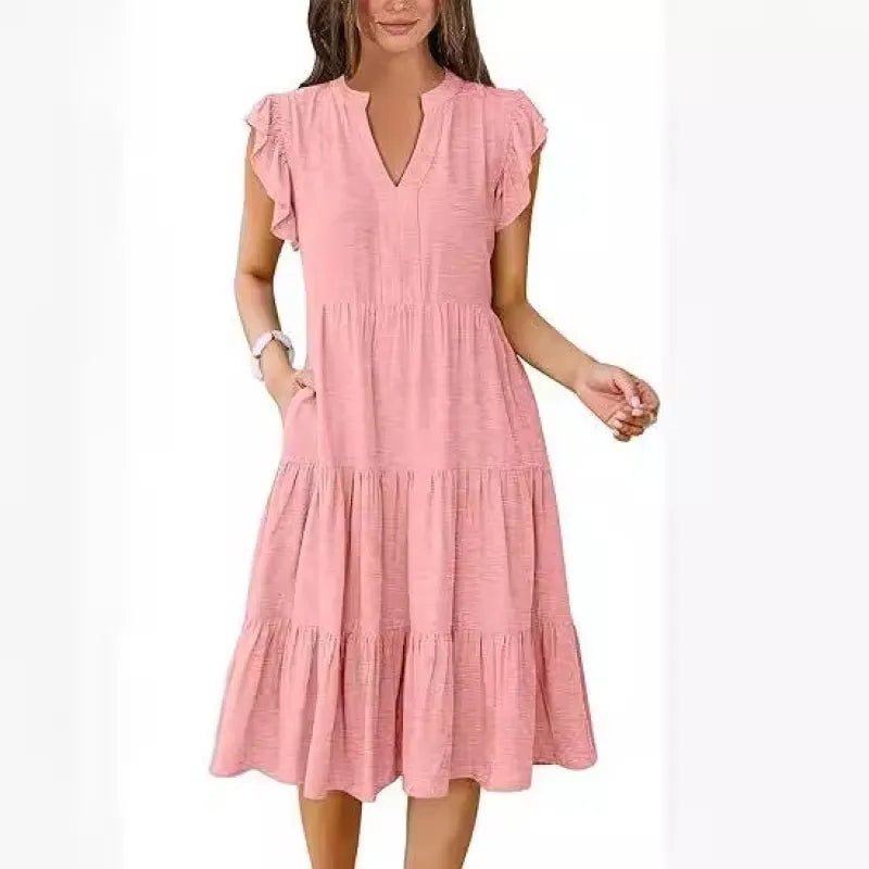 Comfortable women's summer midi dress with V-neck, tiered design, and charming flutter sleeves for vacation.